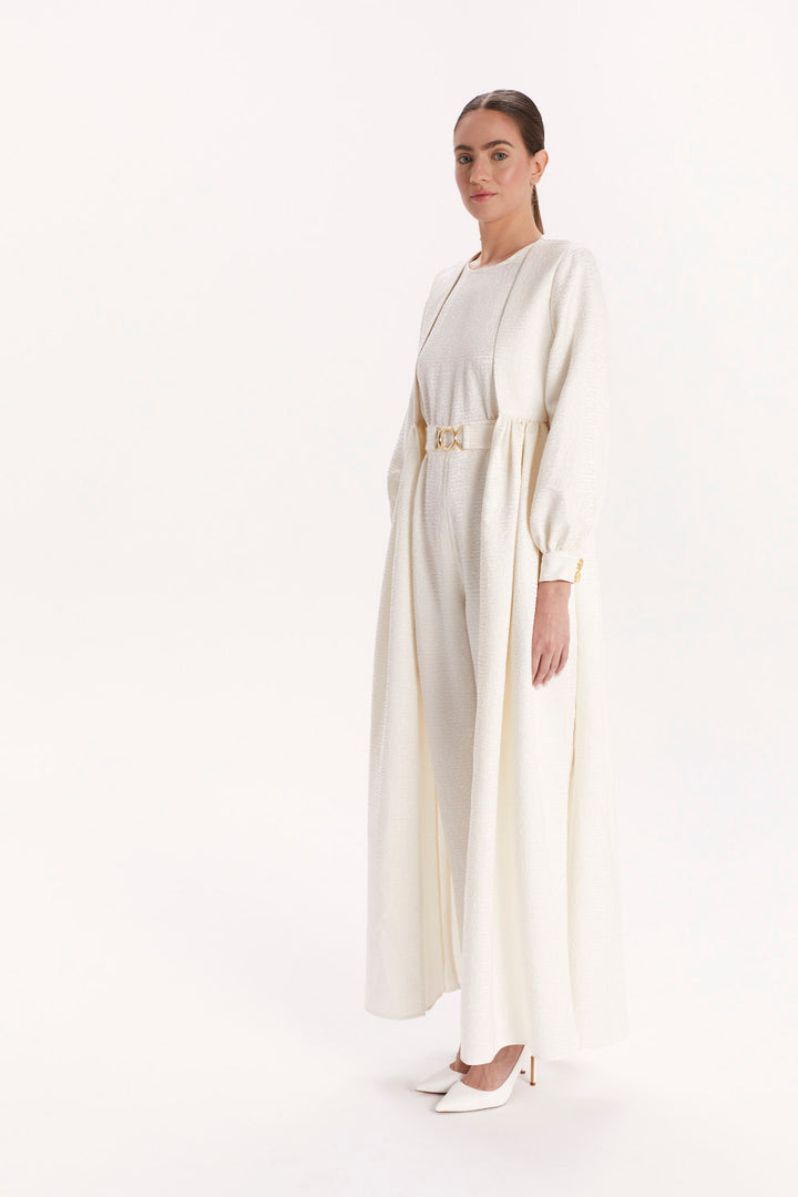 JUMPSUIT WITH A DECORATIVE BELT AND LONG CAPE