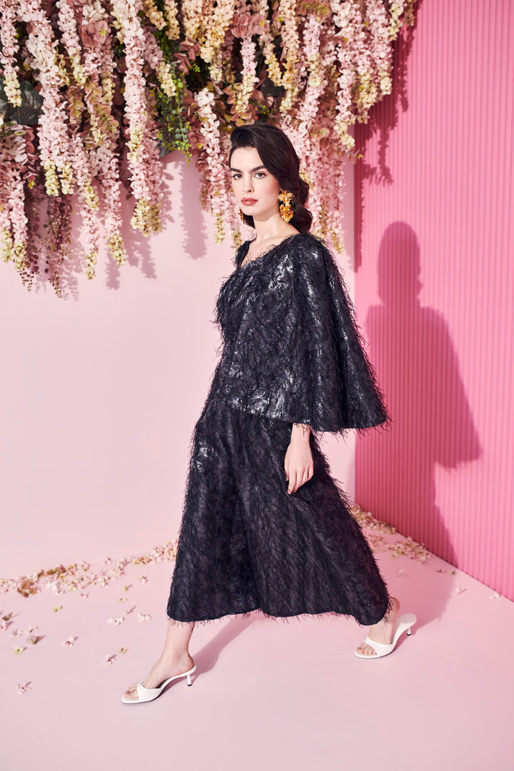 JUMPSUIT WITH ASYMMETRICAL SLEEVES AND WIDE LEGS