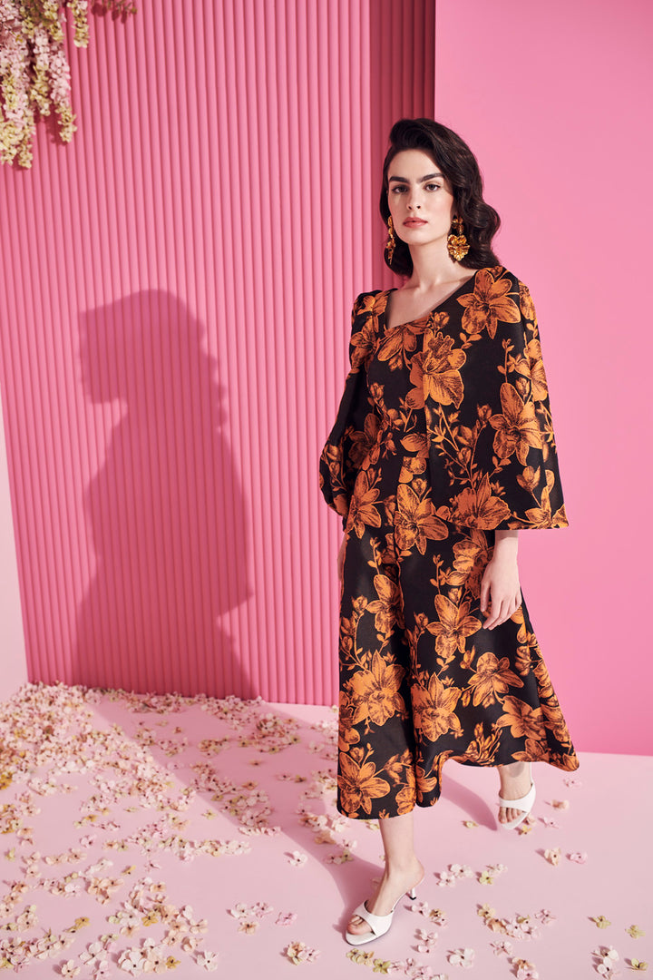 ASYMMETRIC JUMPSUIT WITH CAPE