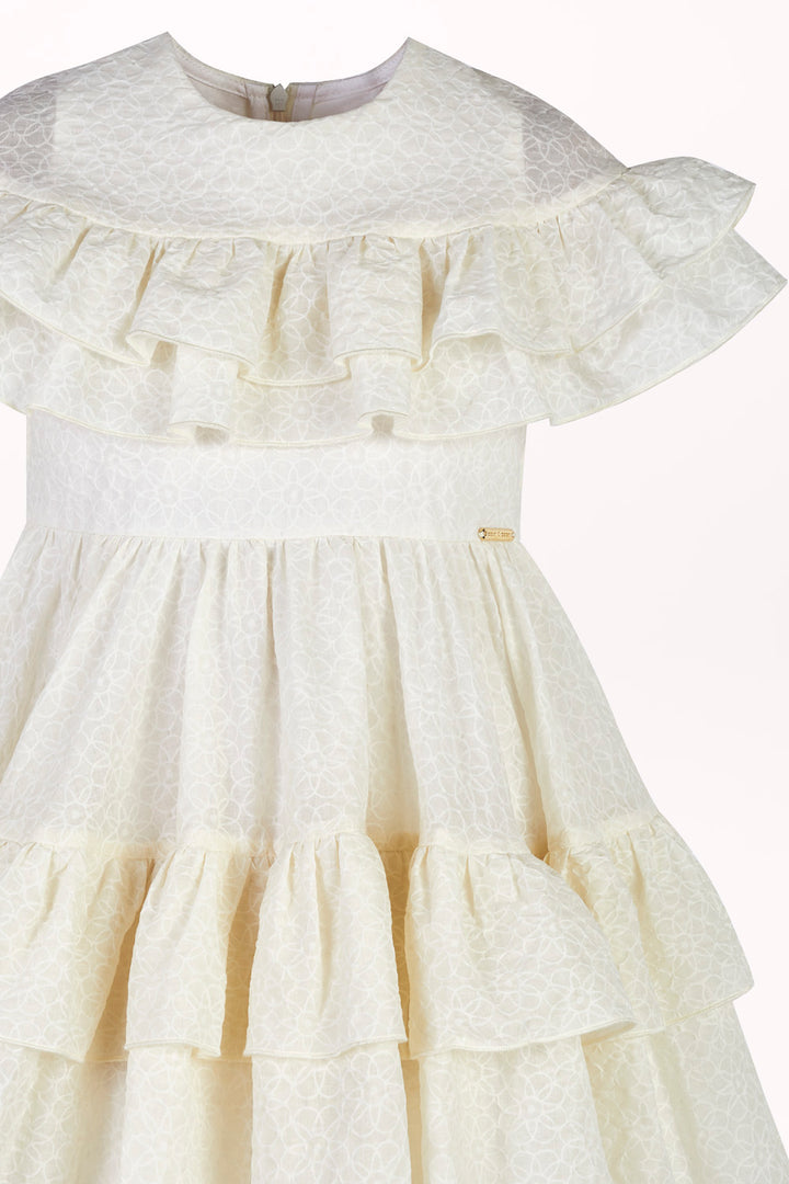 DRESS IN EMBROIDERED FABRIC WITH RUFFLES
