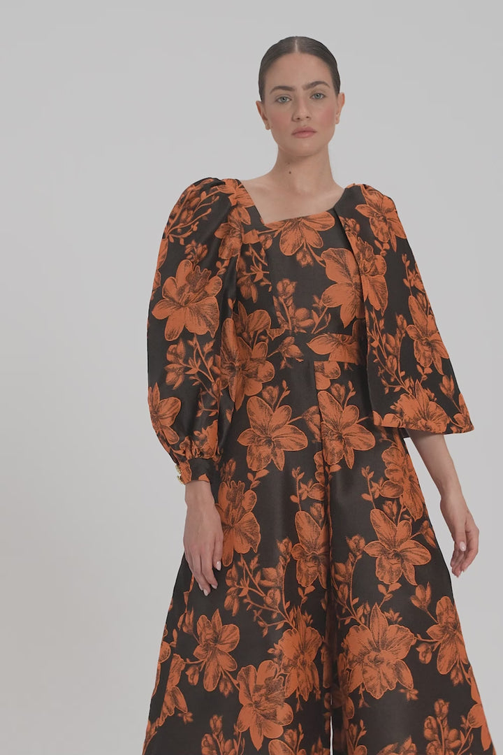 ASYMMETRIC JUMPSUIT WITH CAPE